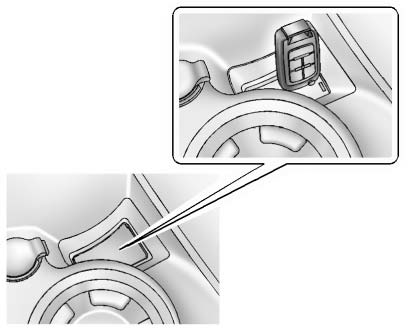 1. Remove the plastic trim piece from the small storage area next to the accessory