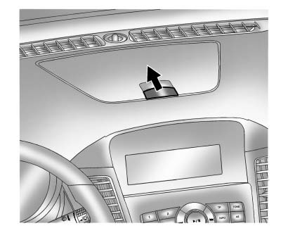 There may be a storage compartment on the instrument panel. Pull the handle to