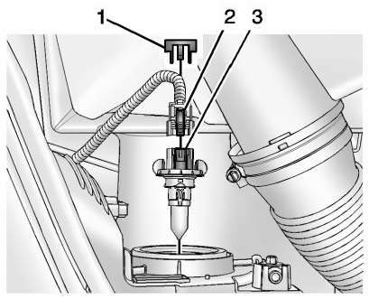 3. Remove the connector retaining tab (1).