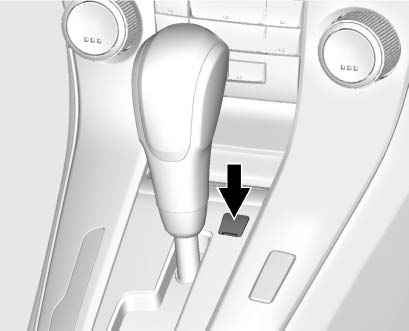 3. Insert a tool into the opening as far as it will go and move the shift lever