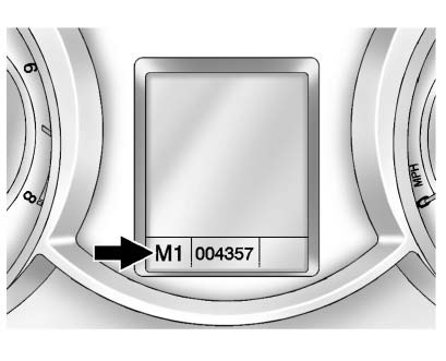 2. Press the shift lever forward (+) to upshift or rearward (−) to downshift.