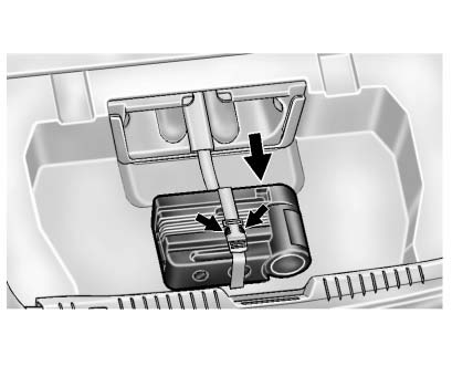 3. Pull the inflator kit rearward.