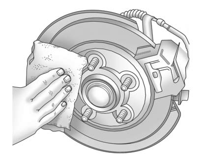 12. Remove any rust or dirt from the wheel bolts, mounting surfaces, and spare